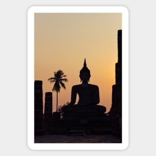 Buddha statue against sunset silhouette Sticker